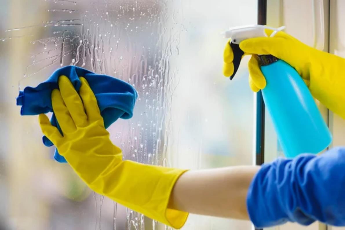 depositphotos_334283806-stock-photo-gloved-hand-cleaning-window-rag (Copy)